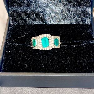 vintage emerald stoned ring on a steel ring